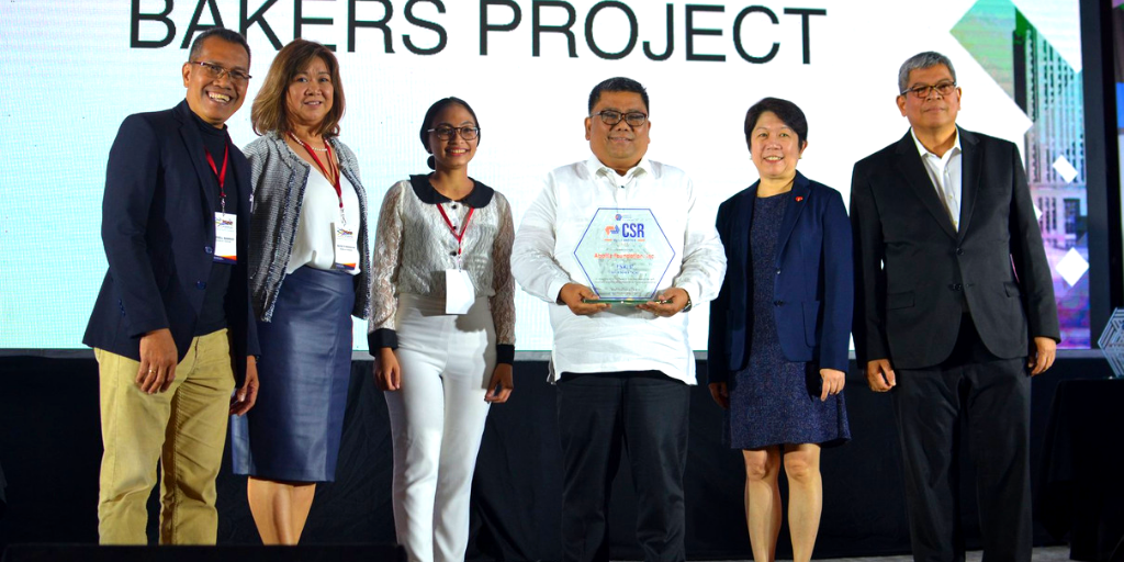 Aboitiz Foundation representatives receiving the Finalist trophy for the “Noble Bakers” Project. 